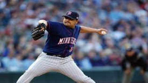 Niko Guardado Father Eddie Guardado  Playing Baseball wearing Blue shirt and white pant